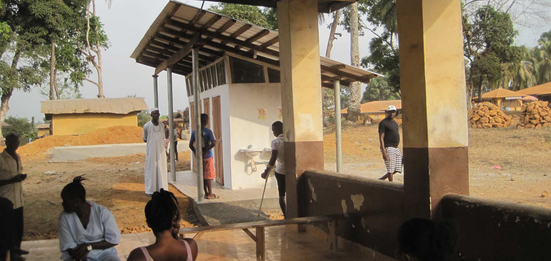 The completed restrooms for the admissions building are in use today and include sinks for hand-washing, seen on the structure's outside wall.