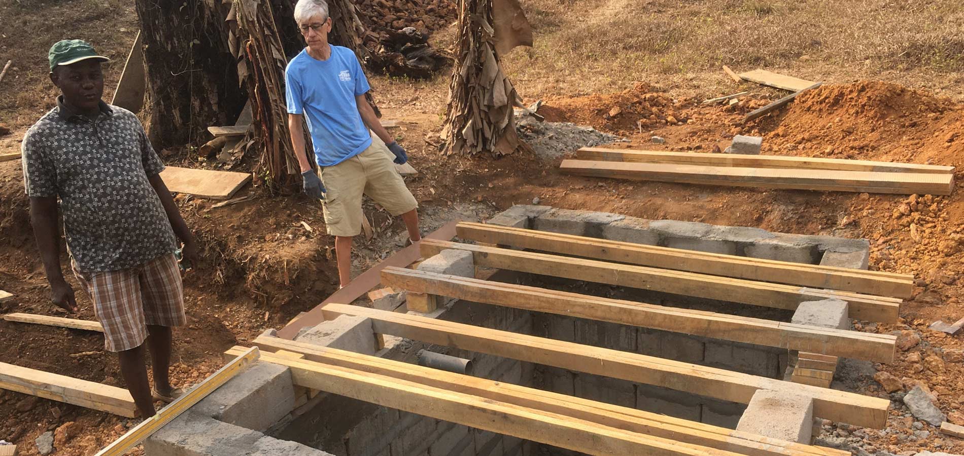 Engineer Carl Zvanut inspects the smaller cesspit for the staff housing.